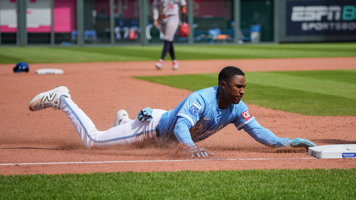 Kansas City Royals shortstop Tyler Tolbert (2) slides into third base against the Minnesota Twins in the eighth inning at Kauffman Stadium on April 10, 2025 in Kansas City.