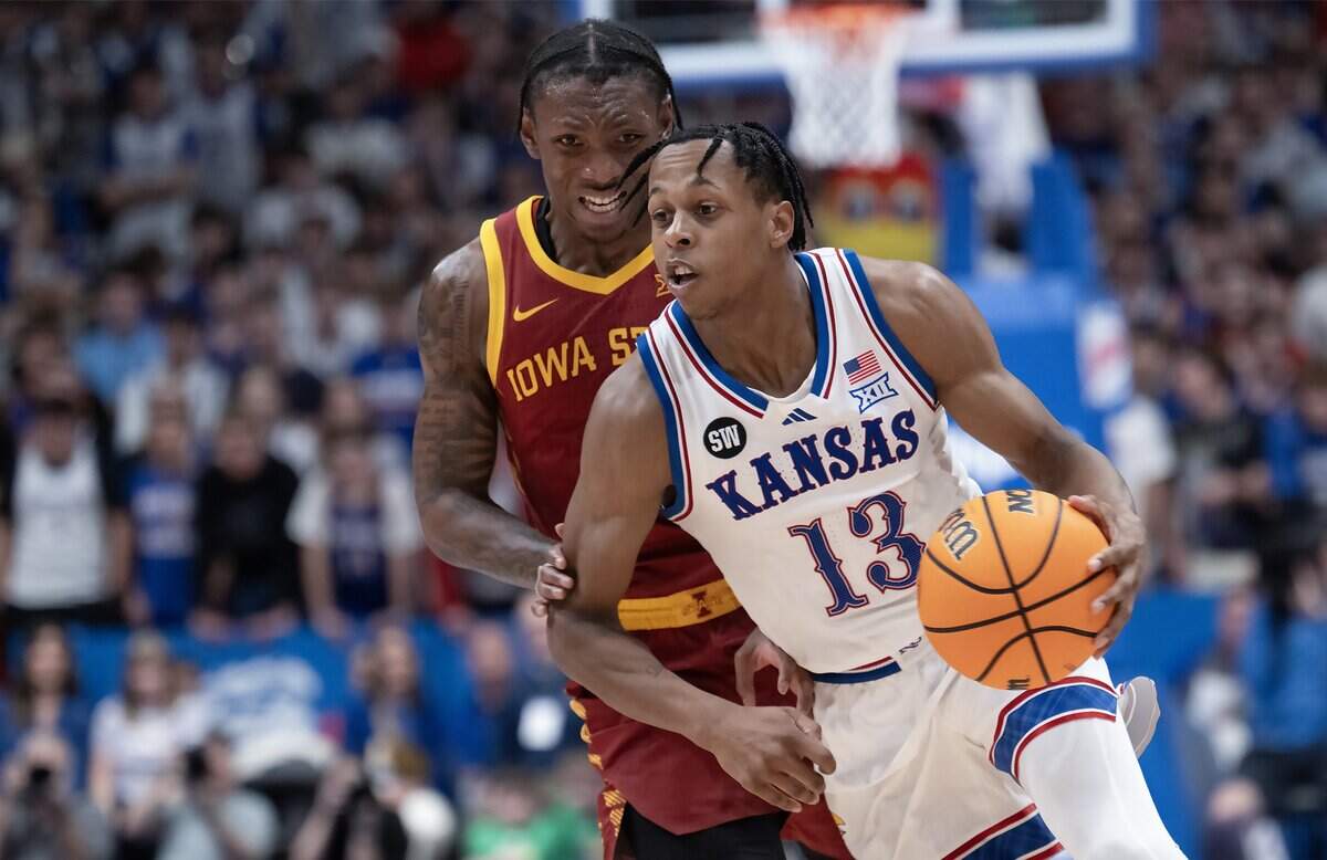 Kansas Jayhawks guard Elmarko Jackson (13) drives in front of Iowa State Cyclones guard Jamarion Batemon (1) in the second half on Tuesday, Jan. 13, 2026, at Allen Fieldhouse in Lawrence.