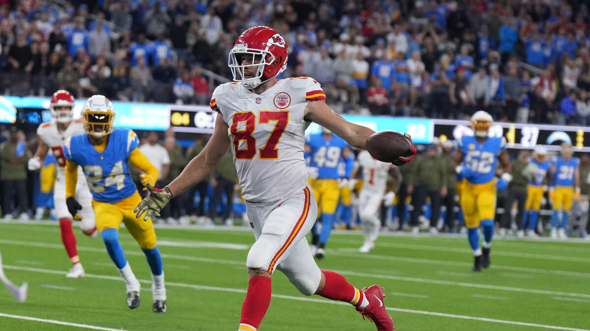 Kansas City Chiefs tight end Travis Kelce (87) celebrates after scoring on a 17-yard touchdown reception with 31 seconds left against the Los Angeles Chargers SoFi Stadium.