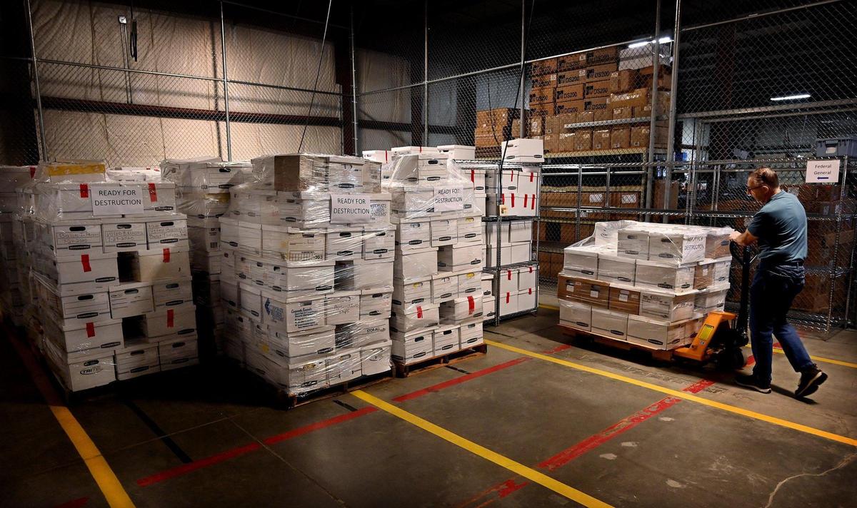 At the Johnson County Election Office, Al Sneller, an employee in the warehouse, moves dozens of boxes into storage that contain ballots, documents and other paperwork from the 2020 general and primary elections, and the August 2, 2022 primary election.