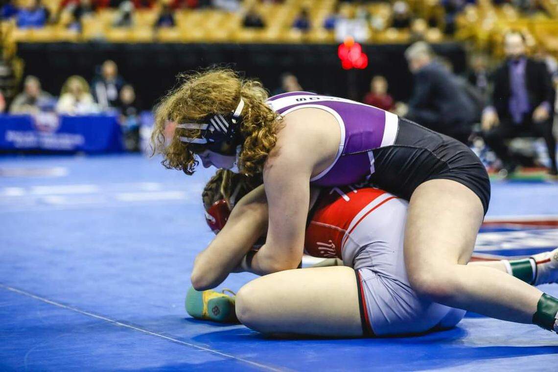 Former Park Hill South wrestler Maddie Kubicki works against her opponent.