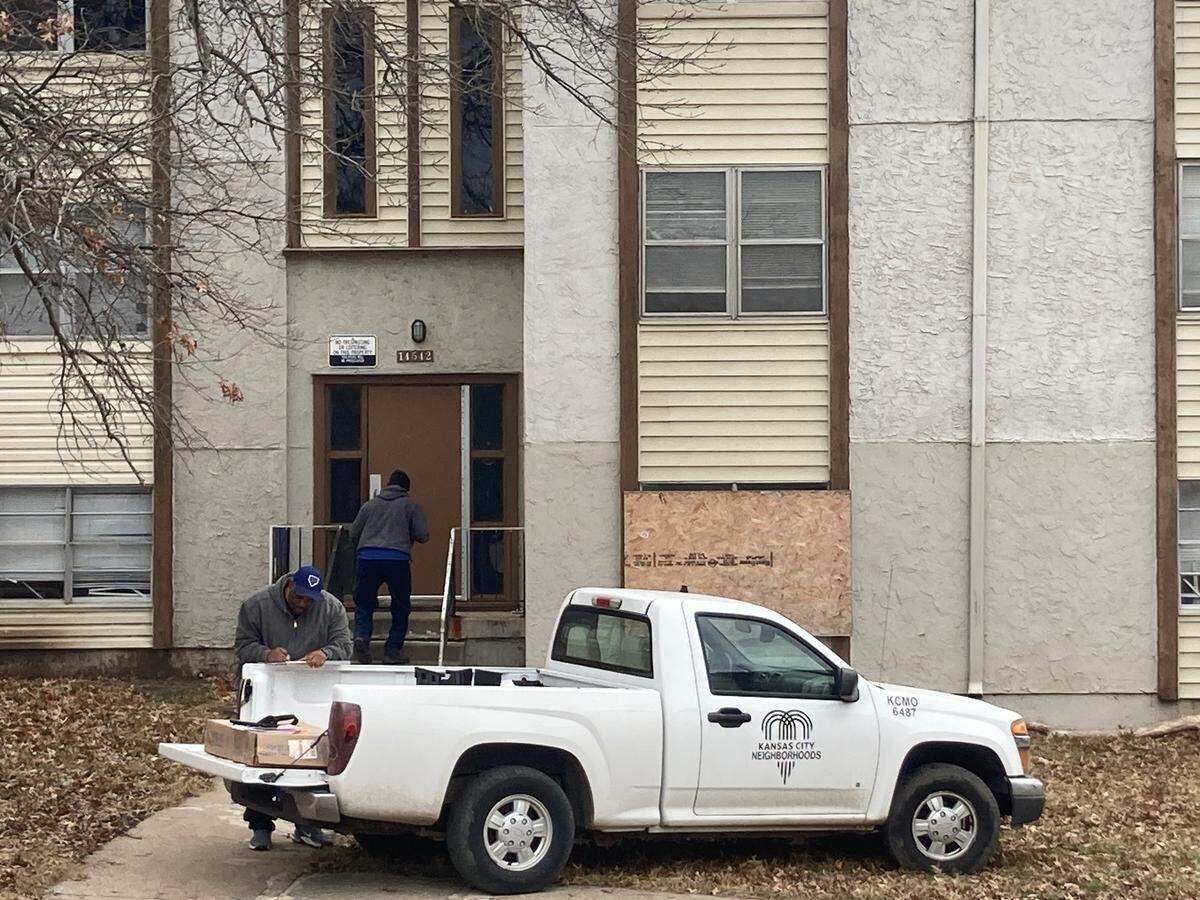 City workers close up the Cloverleaf Apartments in South Kansas City after 76 households were evacuated. the KC Fire Department declared the complex to be unsafe and uninhabitable