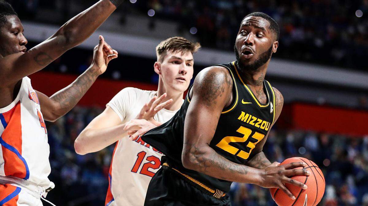 Mizzou forward Jeremiah Tilmon (23) looks to pass against the Florida Gators at Exactech Arena in Gainesville on Wednesday, March 3, 2021.