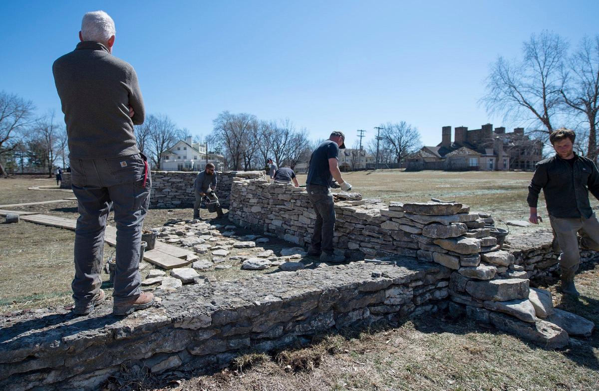 Artist Andy Goldsworthy (left) watches as his crew builds the “Walking Wall” in the first section at The Nelson-Atkins Museum of Art. When all the components of the “Walking Wall” are completed, it will cross temporarily cross Rockhill Road and connect the inside of the museum to the outside.