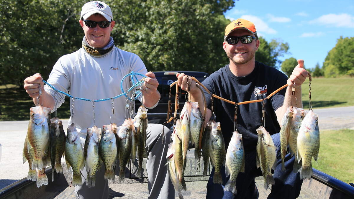 Payden Hays, left, and the author, Tyler Mahoney, show off limits of crappie caught while fishing with Tandem Fly Outfitters on Stockton Lake.