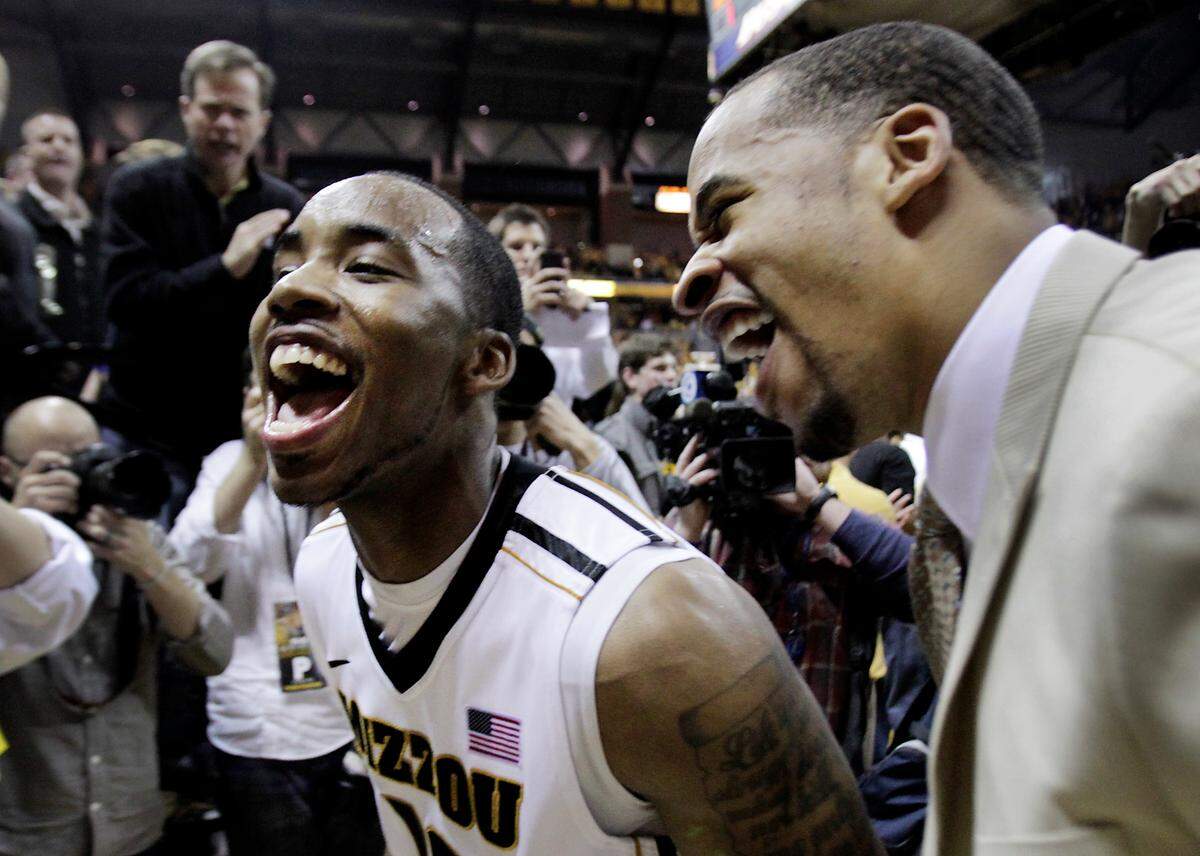 MU’s Marcus Denmon got to celebrate with teammate Laurence Bowers after he scored 29 points to lead the Tigers to a 74-71 win over Kansas Saturday night at Mizzou Arena. RICH SUGG/The Kansas City Star_02042012