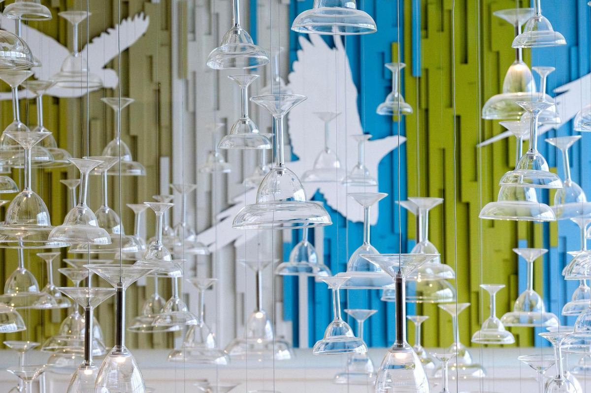 A chandelier featuring upside-down margarita glasses hangs at the south entrance of Margaritaville on Tuesday, June 17, 2025, in Kansas City, Kansas.