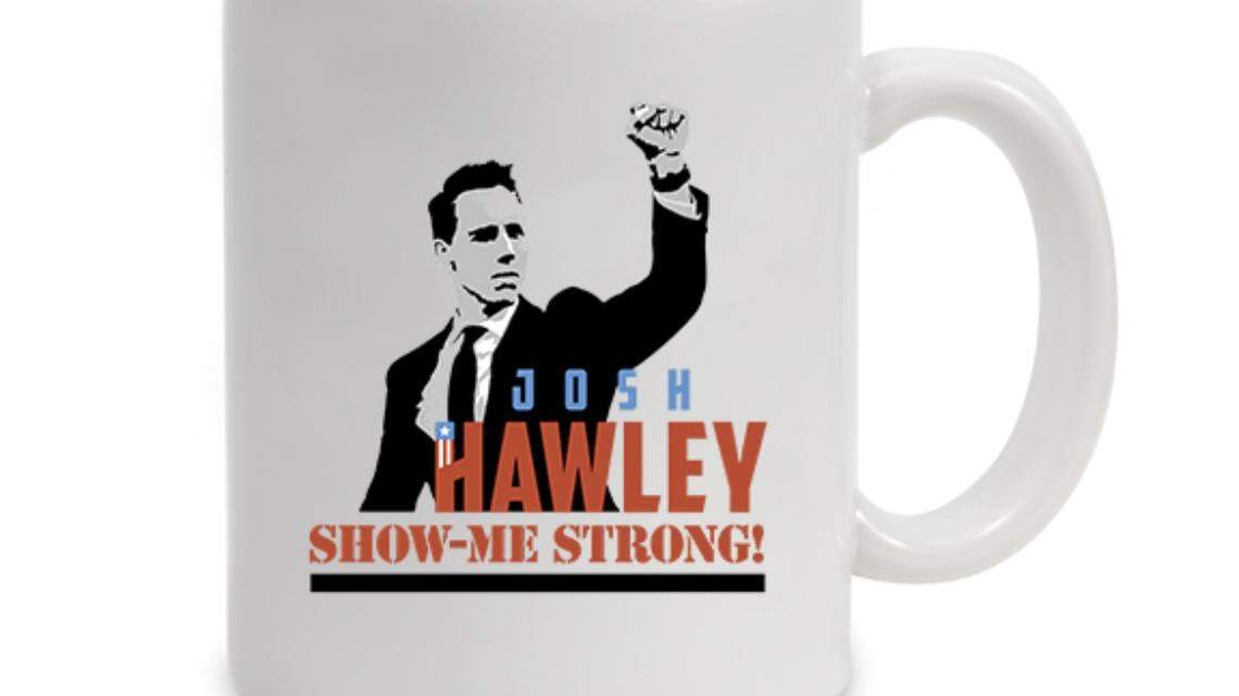 Missouri Sen. Josh Hawley says he will not stop using a Jan. 6, 2021 photo showing him clenching his fist before rioters violently stormed the U.S. Capitol. His campaign is selling a coffee mug with the image for $20. Attorneys for Politico, the news site that says it owns the photo, wants him to cease and desist. (Screenshot/Josh Hawley campaign website)