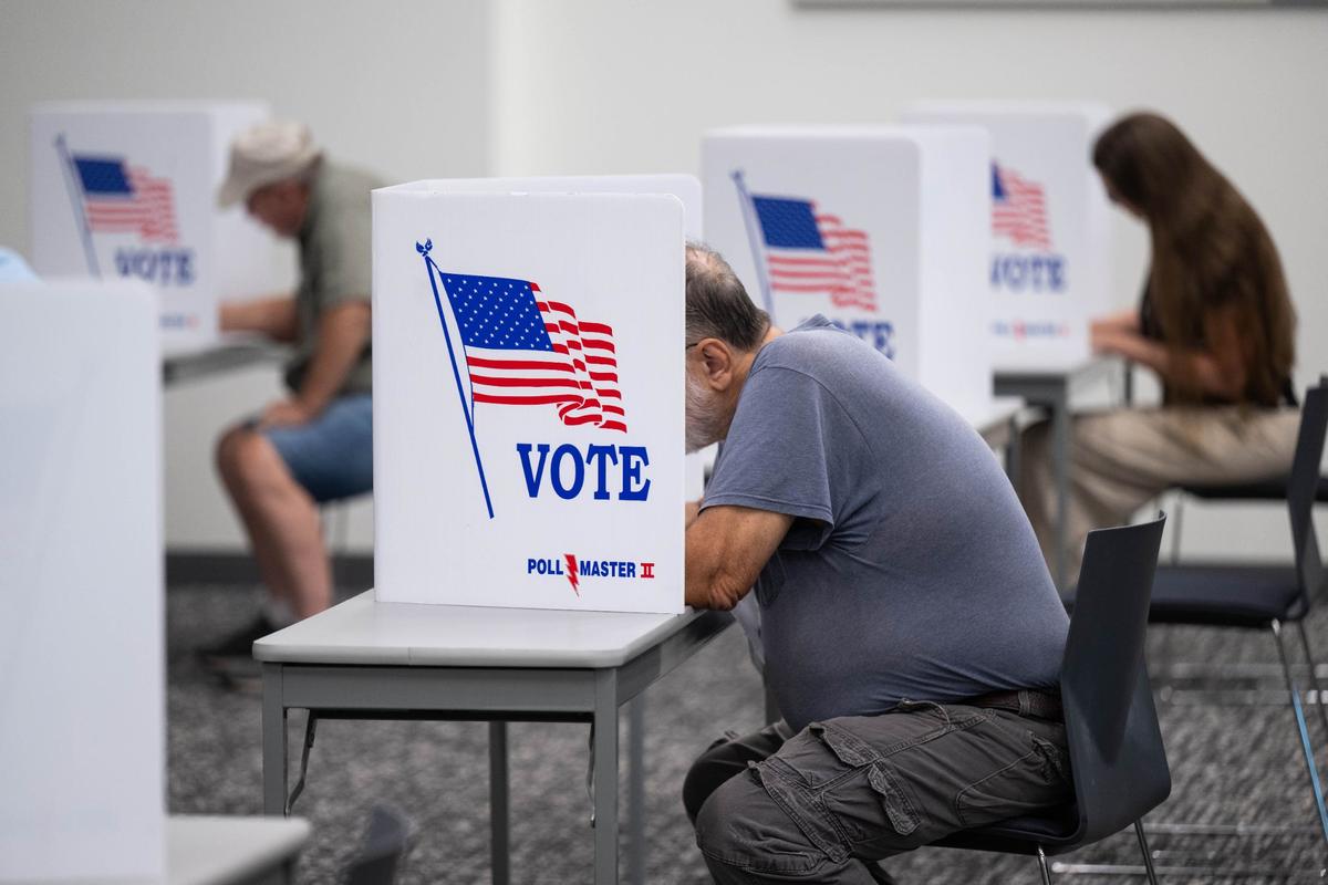 Voters cast ballots for the Missouri primary election at the Midwest Genealogy Center on Tuesday, Aug. 6, 2024, in Independence.