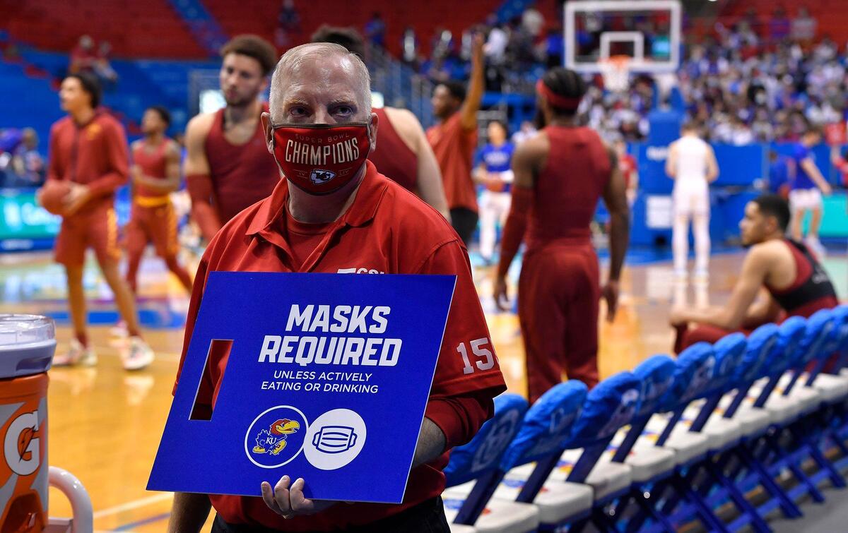 Masks are once again required at Allen Fieldhouse for KU basketball games. At Tuesday night’s men’s game against Iowa State, all ushers were holding signs just in case fans didn’t get the message.