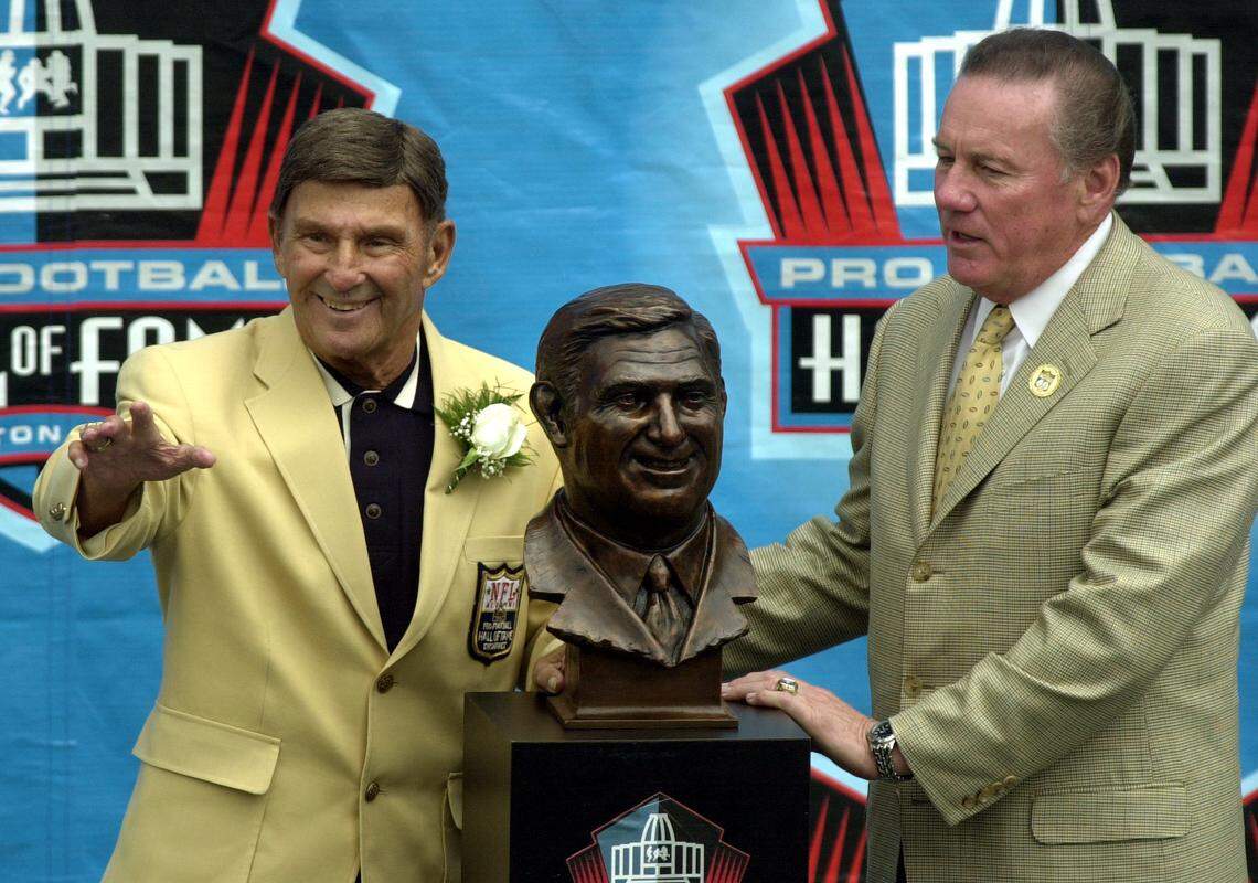 Former Kansas City Chiefs head coach Hank Stram, left, and his presenter, Chiefs Hall of Fame quarterback Len Dawson, have their photos taken with Stram’s bust after the 2003 induction ceremony into the Pro Football Hall of Fame in Canton, Ohio.