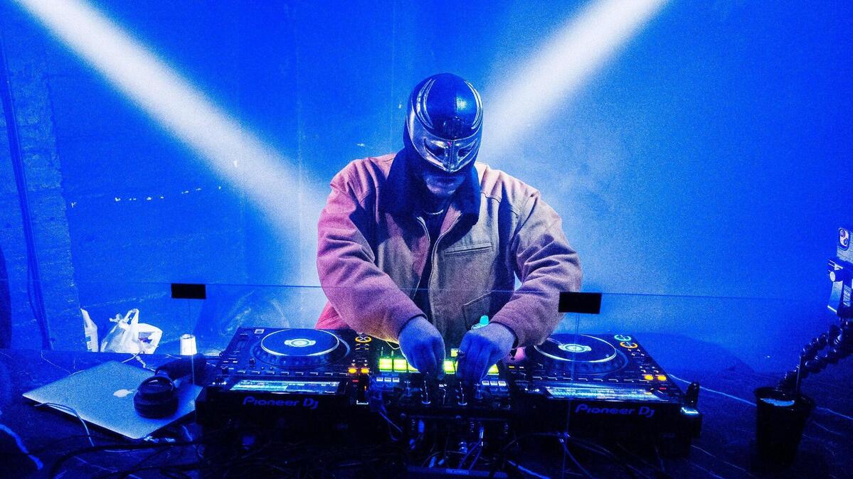 FK Menace comes from a family of lucha libre wrestlers and honors his heritage through wearing his family’s wrestling mask as he performs as a DJ and artist.