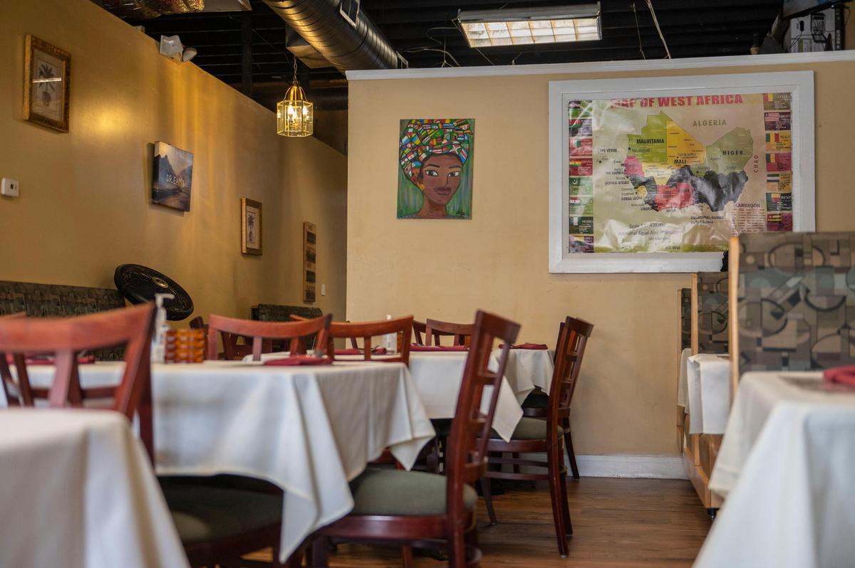 A map of West Africa and several other art pieces decorate the walls of Fannie’s West African Cuisine.