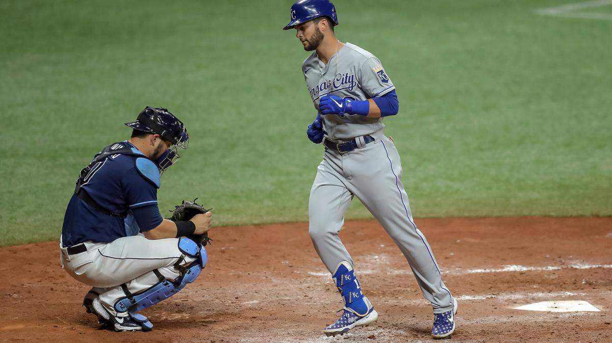 Kansas City Royals’ Andrew Benintendi scores on a home run in front of Tampa Bay Rays catcher Mike Zunino during the ninth inning of a baseball game Wednesday, May 26, 2021, in St. Petersburg, Fla. (AP Photo/Mike Carlson)