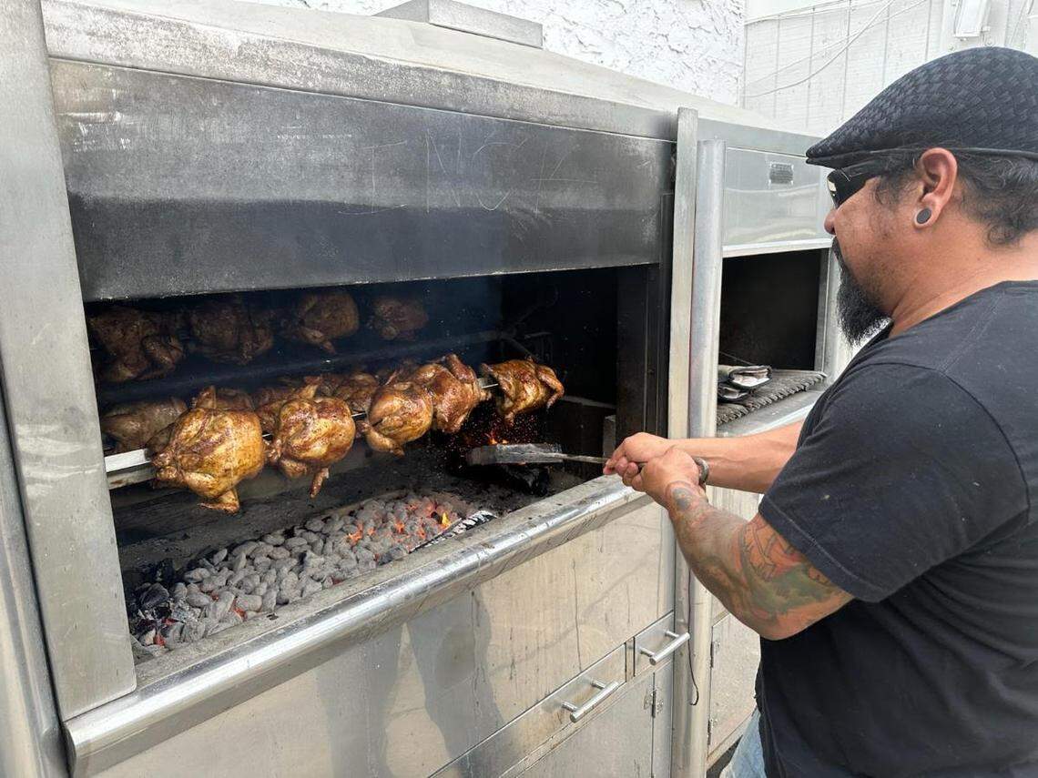 Cisco Huaman at his rotisserie oven. He marinates the chicken at least 24 hours and then grills it for an hour.
