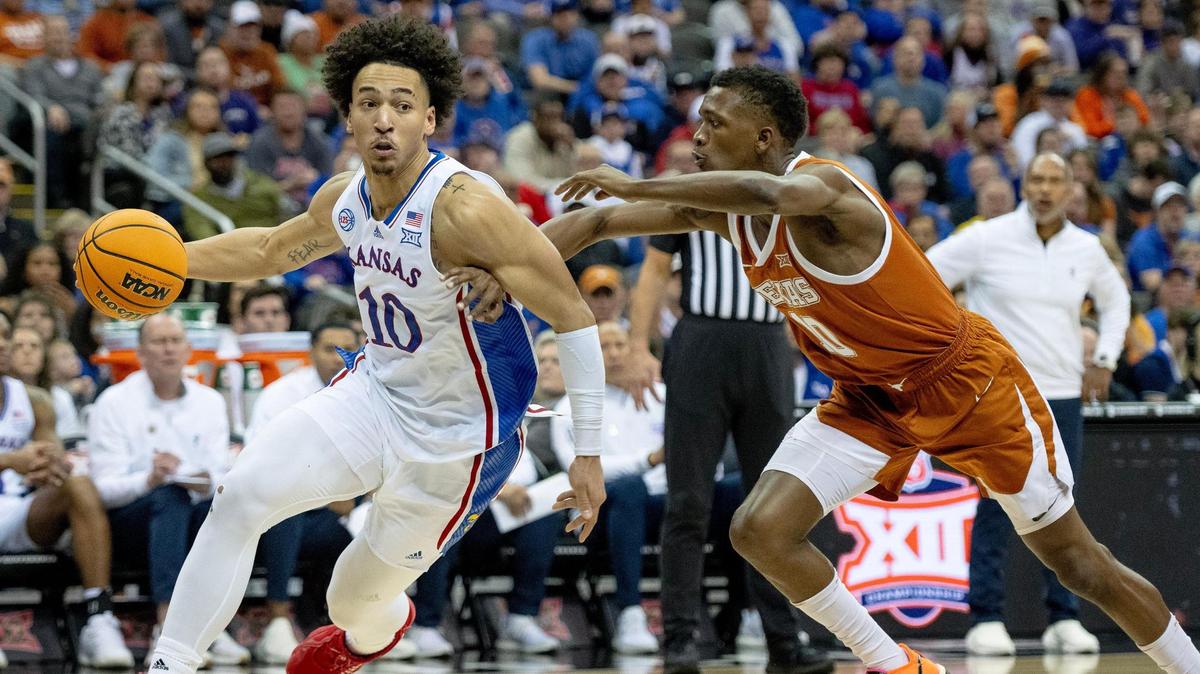 Kansas forward Jalen Wilson (10) drives to the hoop against Texas guard Sir’Jabari Rice (10) during the Big 12 Tournament championship game Saturday, March 11, 2023, in Kansas City.