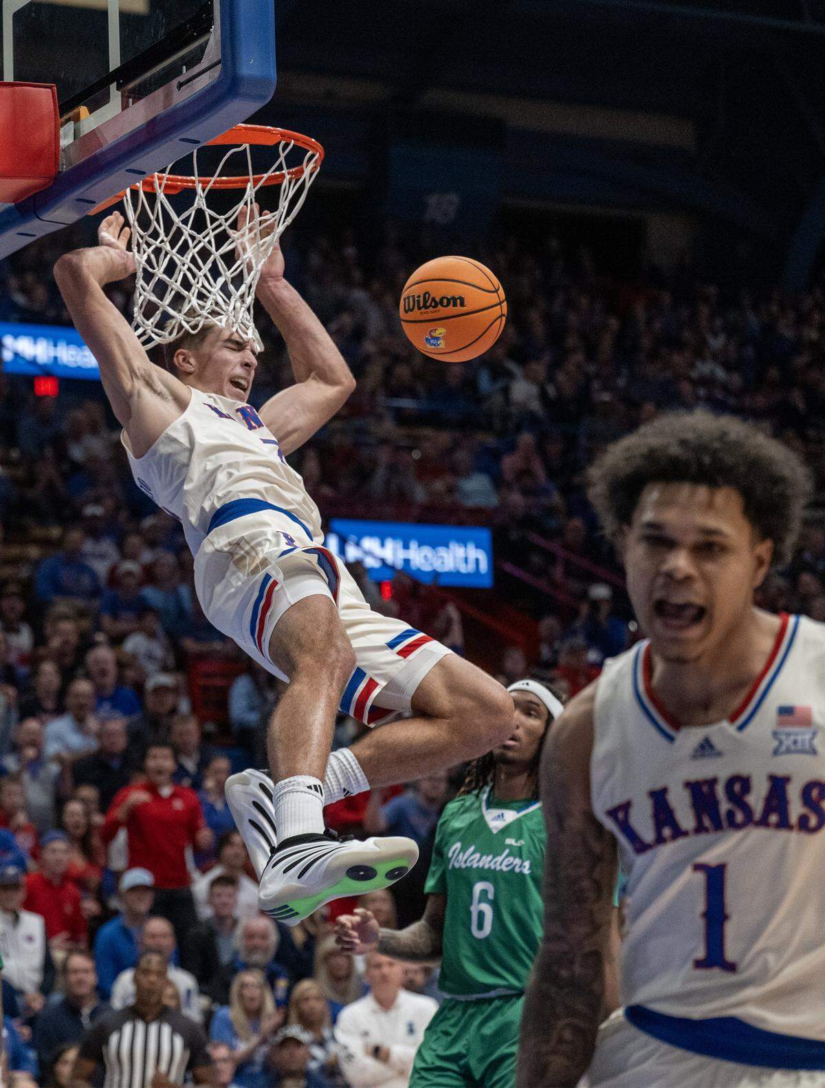 Kansas Jayhawks guard Kohl Rosario (7) slams the ball during the first half against Texas A&M-CC Islanders at Allen Fieldhouse on Tuesday, November 11, 2025, in Lawrence.