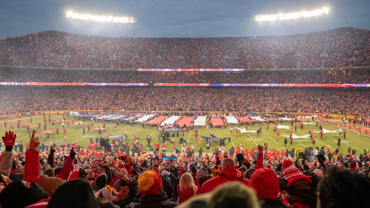 Kansas City Chiefs fans celebrate the national anthem before the AFC Championship Game against the Cincinnati Bengals at GEHA Field at Arrowhead Stadium on Sunday, Jan. 29, 2023, in Kansas City.