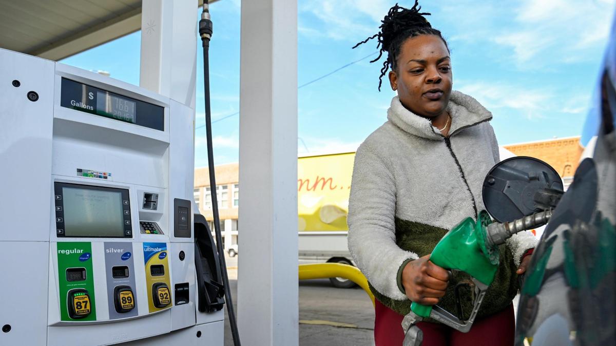 Olivia Johnson of Kansas City filling up at the pump in March.
