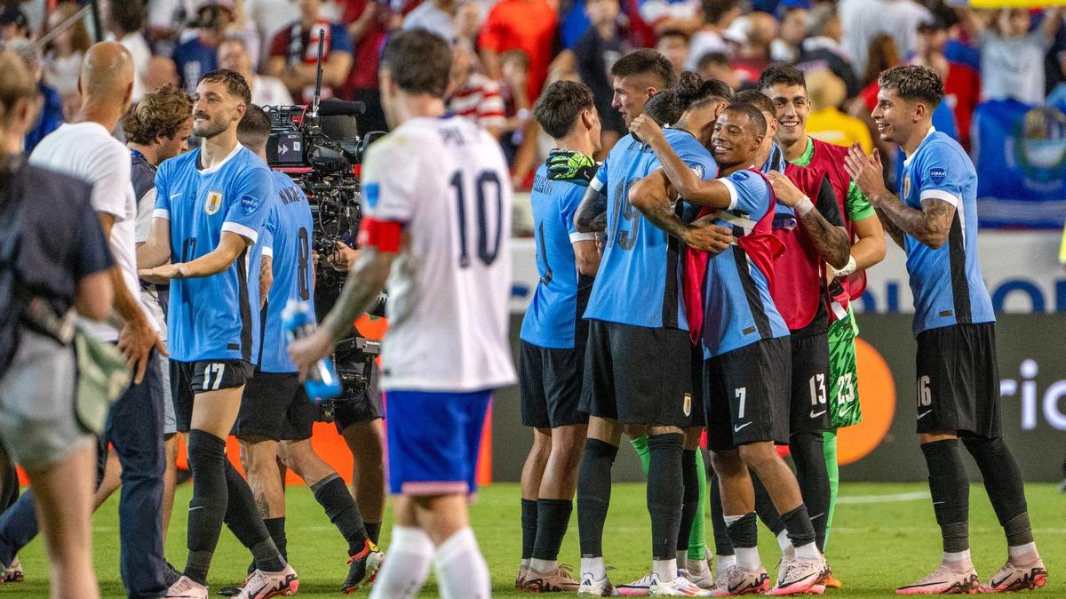 Uruguay celebrates a 1-0 victory over the United States in a Copa America match as U.S. captain Christian Pulisic looks on at GEHA Field at Arrowhead Stadium on Monday, July 1, 2024, in Kansas City.