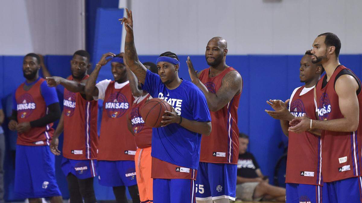 Former KU Jayhawk Mario Chalmers (center) was also in Lawrence last month for a scrimmage at Bill Self's basketball camp.