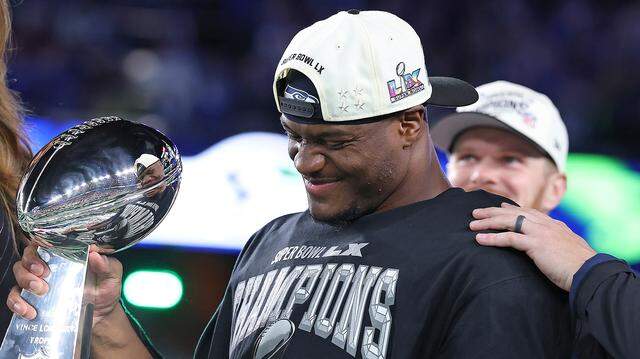 Kenneth Walker III #9 of the Seattle Seahawks celebrates with the Vince Lombardi Trophy after defeating the New England Patriots 29-13 to win Super Bowl LX at Levi's Stadium on Feb. 8, 2026 in Santa Clara, California.