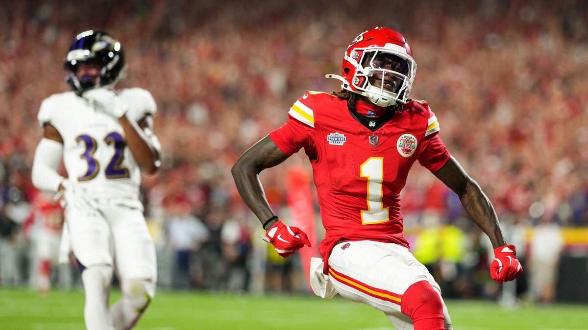 Kansas City Chiefs wide receiver Xavier Worthy (1) scores a touchdown against Baltimore Ravens safety Marcus Williams (32) during the first half at GEHA Field at Arrowhead Stadium on Sept. 5, 2024.