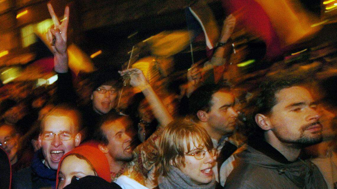 Czechs celebrated during a peaceful demonstration in Prague on Nov. 17, 2004, to celebrate 15 years of 'Velvet Revolution' and the fall of communism in former Czechoslovakia in 1989. 