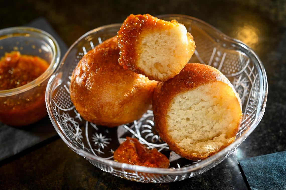 Fannie’s West African Cuisine showed off their Puff Puff’s with dipping sauce at the Kansas City Restaurant Week preview at the J. Rieger & Co. Distillery on Tuesday, Jan. 11, 2022, in Kansas City. KC Restaurant Week runs January 14-23 and features nearly 200 restaurants. Fannie’s is at 4105 Troost Ave., in Kansas City.