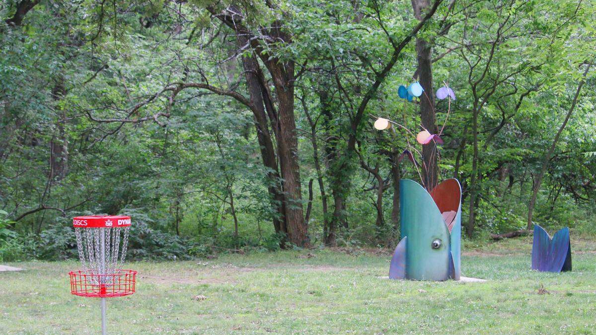 Scott Diven’s fish sculpture, “Sweet Spot,” stands near the second hole of Shawnee Mission Park’s Art Nine disc golf course.