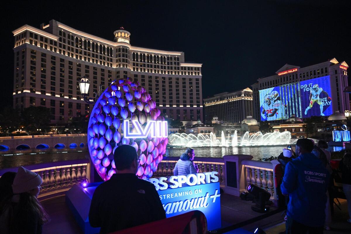 Super Bowl-themed murals were projected on the side of Caesars Palace where fans took in the sights including the fountains of Bellagio Las Vegas where CBS Sports is set up at on the strip on Thursday, Feb. 8, 2024, in Las Vegas, Nevada.