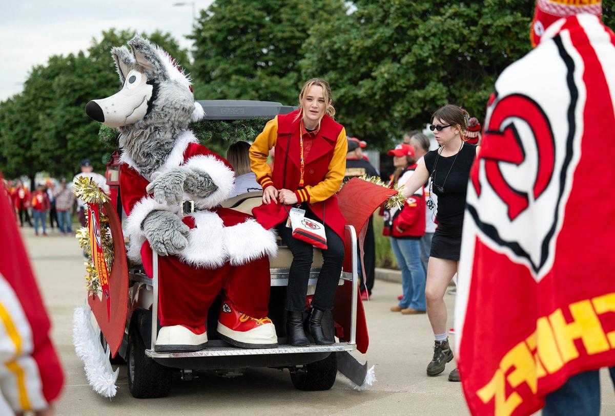Kansas City Chiefs mascot KC Wolf sat with actress Hunter King in a golf cart decked out as Santa’s sleigh for a scene filmed in July at GEHA Field at Arrowhead Stadium for the Hallmark Christmas movie “Holiday Touchdown: A Chiefs Love Story.”
