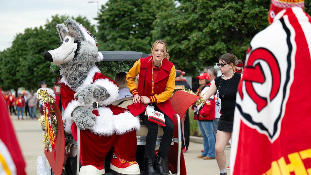 Kansas City Chiefs mascot KC Wolf sat with actress Hunter King in a golf cart decked out as Santa’s sleigh for a scene filmed in July at GEHA Field at Arrowhead Stadium for the Hallmark Christmas movie “Holiday Touchdown: A Chiefs Love Story.”