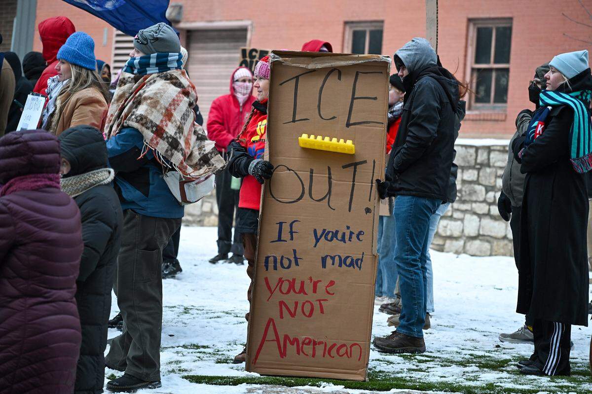 Protesters joined nationwide demonstrations against ICE in downtown Kansas City in freezing temperatures on Friday, Jan. 30, 2026.