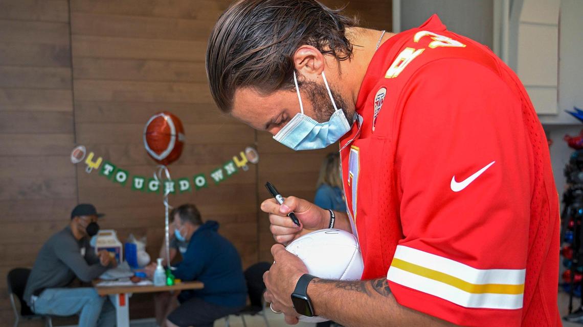 Kansas City Chiefs tight end Noah Gray autographed a football Wednesday while visiting pediatric patients at Children’s Mercy Research Institute.