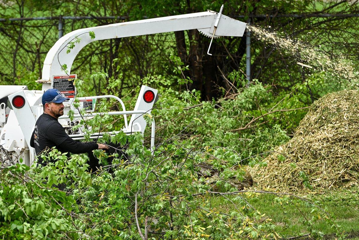 Dallas Stephens, owner of Arb Tech Kansas City, brought his wood chipper to help get rid of branches cleared along the fence line by other volunteers. A small army of volunteers helped give Freeway Park Community Garden in Kansas City’s historic Northeast a makeover for its 20th anniversary. The garden, near E. 14th Street and Indiana Avenue, is managed by Kansas City Community Gardens, which rents plots to neighborhood gardeners.