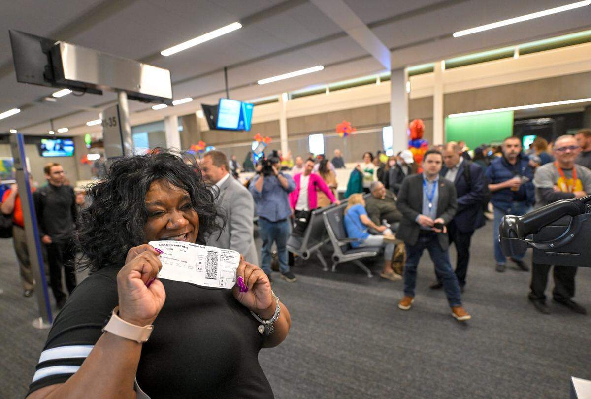 Southwest Airlines travelers including Skye McAdoo-Spearmann of Kansas City, Kansas, began boarding the first flight out of the new $1.5 billion single terminal at Kansas City International Airport opened to travelers Tuesday, Feb. 28, 2023.