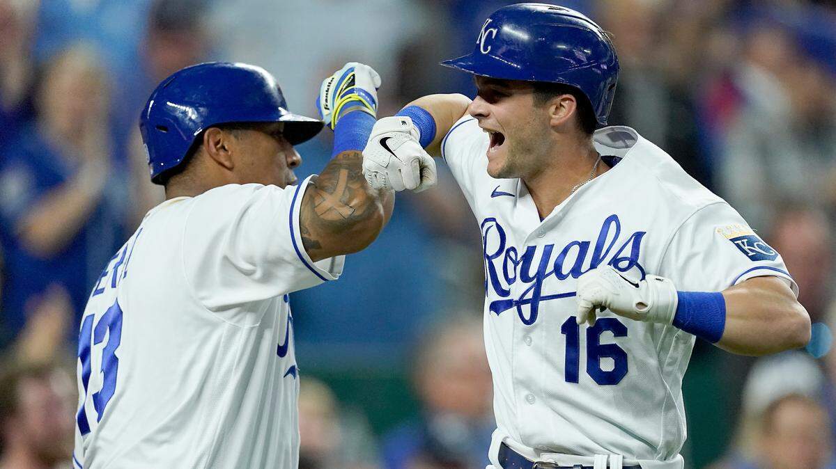 Kansas City Royals’ Andrew Benintendi (16) celebrates with Salvador Perez (13) after hitting a grand slam during the fifth inning of a baseball game against the Pittsburgh Pirates Tuesday, June 1, 2021, in Kansas City, Mo. (AP Photo/Charlie Riedel)