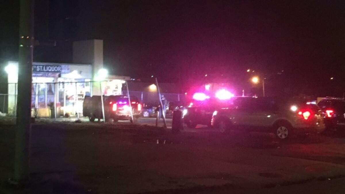 Officers investigated after a double shooting Thursday in the area of 14th Street and Minnesota Avenue in Kansas CIty, Kan.