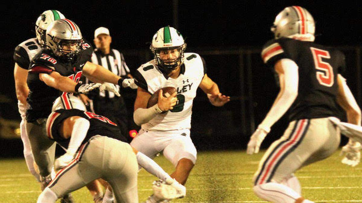 Staley quarterback Cole Robertson breaks off a run during the Falcons’ 34-33 win at Blue Valley West.