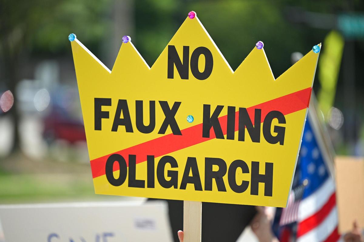 Protesters march along 87th Street in Lenexa on Saturday, June 14, 2025, for the “No Kings” rally. Several “No Kings” rallies intended to protests the policies of the Trump administration are scheduled across the country and the Kansas City metro area.