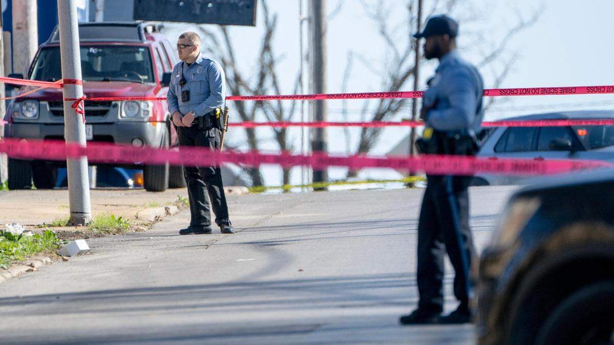 KCKPD officers stand near the scene where three officers were shot on Wednesday, April 5, 2023, in Kansas City, Kan.