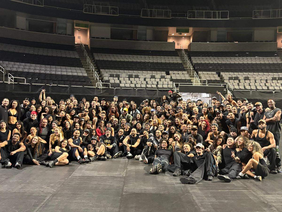A group photo featuring all the dancers who performed with Bad Bunny during the Super Bowl LX halftime show.