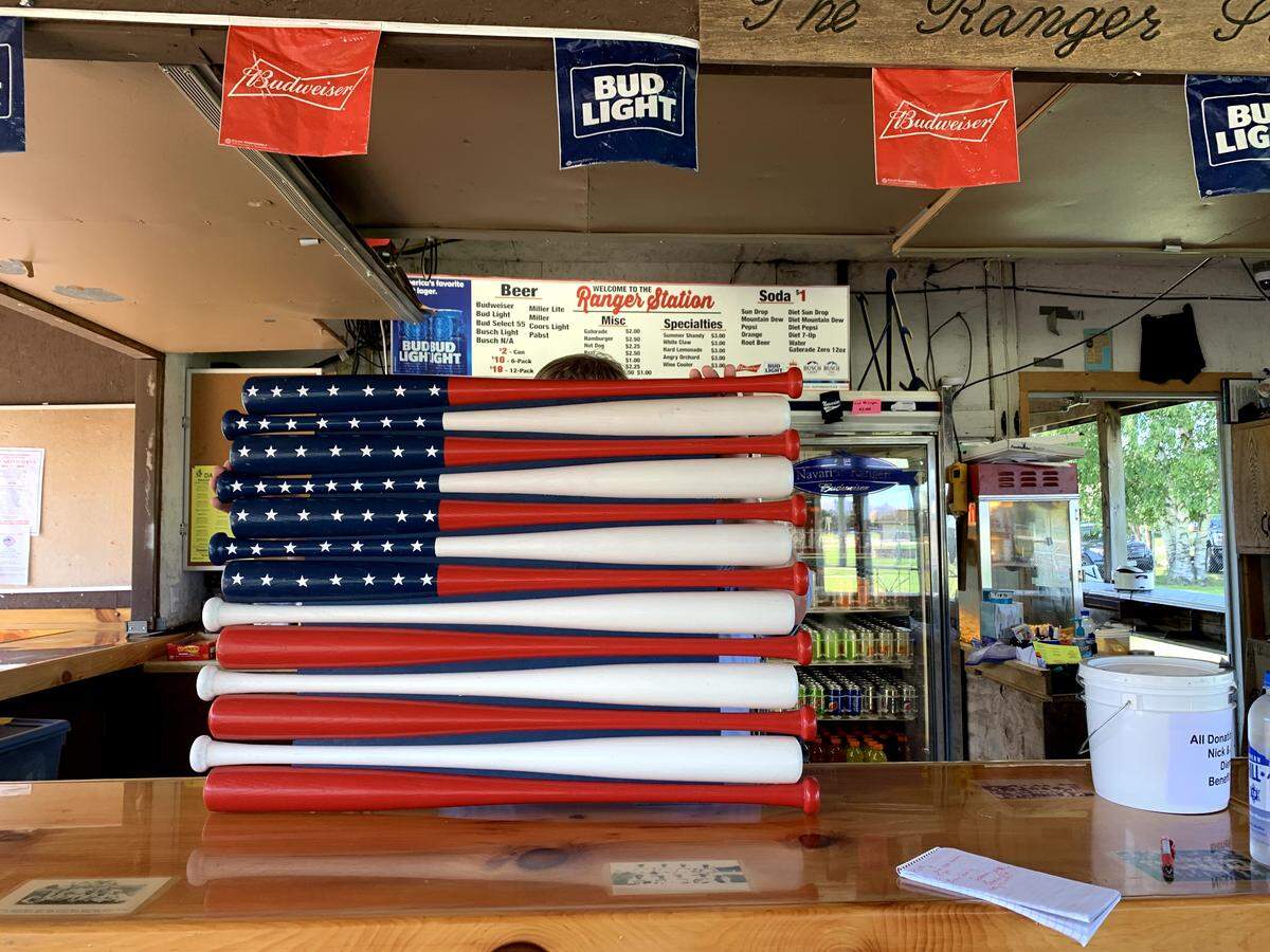 A figure of the U.S. flag, made of baseball bats, is raffled off by the local Navarino Rangers baseball team to raise money for the Diemel family in Shawano County, Wisconsin. Nick and Justin Diemel disapeared on a trip to Missouri last month.
