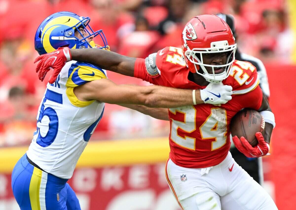 Kansas City Chiefs running back Brashard Smith (24) tries to fight off Los Angeles Rams safety Nick Andersen (45) in the Chiefs vs. Rams preseason game at Arrowhead Stadium in Kansas City on Aug. 15, 2026.