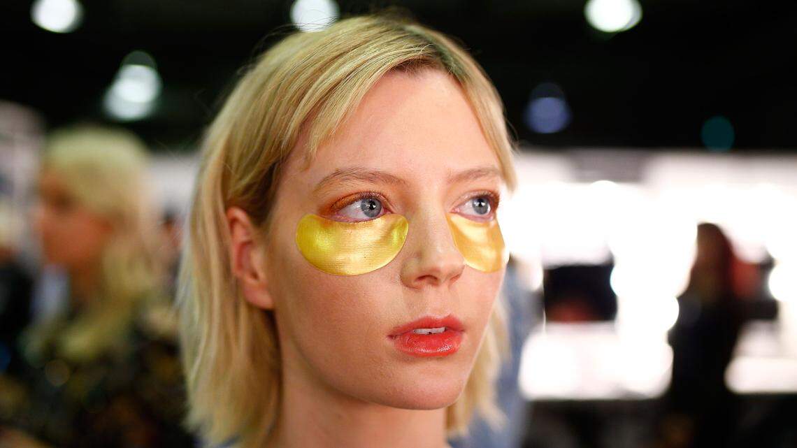 A model with skincare patches.