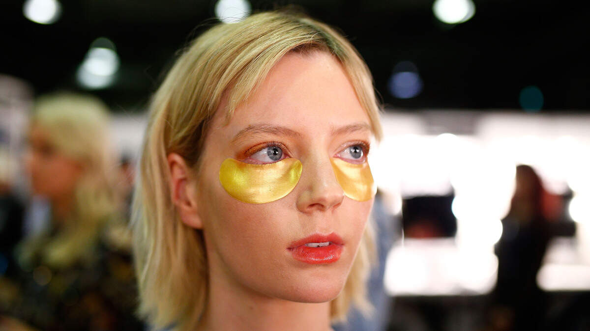 A model with skincare patches.
