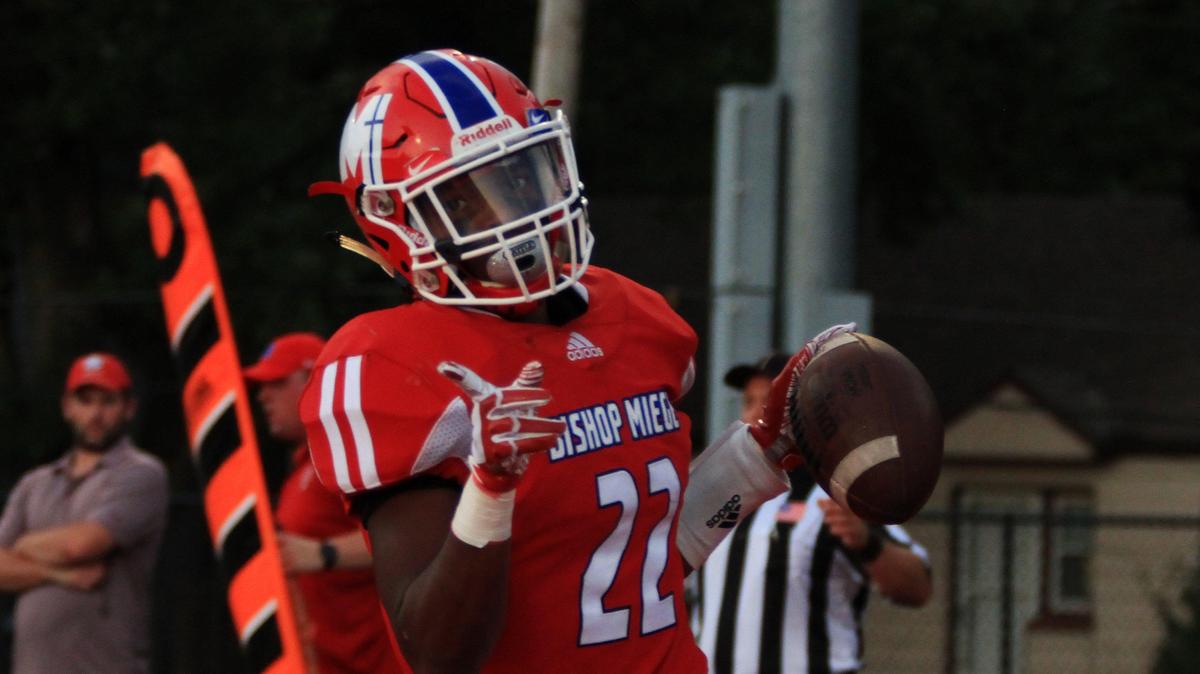 After finding the end zone, Brison Cobbins celebrates a Bishop Miege touchdown Friday night against Blue Valley North at Dixon Doll Stadium. The score helped the Stags open up a 20-0 lead in the first half.