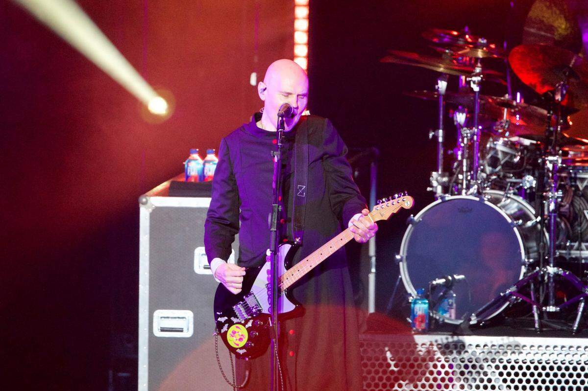 Billy Corgan of The Smashing Pumpkins performs at Starlight Theatre in Kansas City on Wednesday. Both acts took the stage early to beat the thunderstorms.