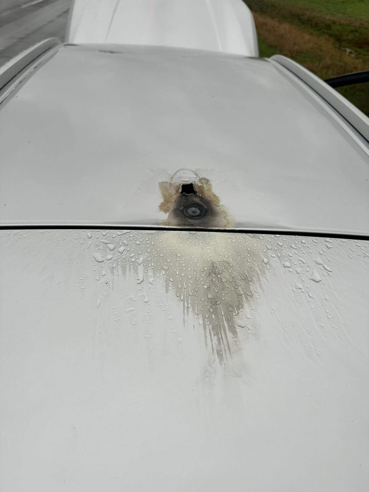 The lightning left a hole in the roof of the car, deputies said.
